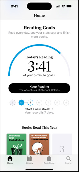 iPhone screen showing the Reading?Goals interface in the Books app. At the top, there is a progress ring. Below the progress ring is the weekly reading streak tracker. At the bottom is the Books?Read?This?Year section, which includes a row of two books, with an empty slot for a third