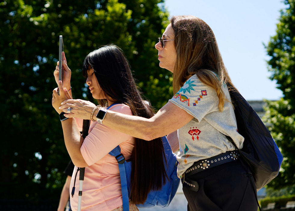 Shelle Hamer is shown walking outdoors with Alaula Sprecher.