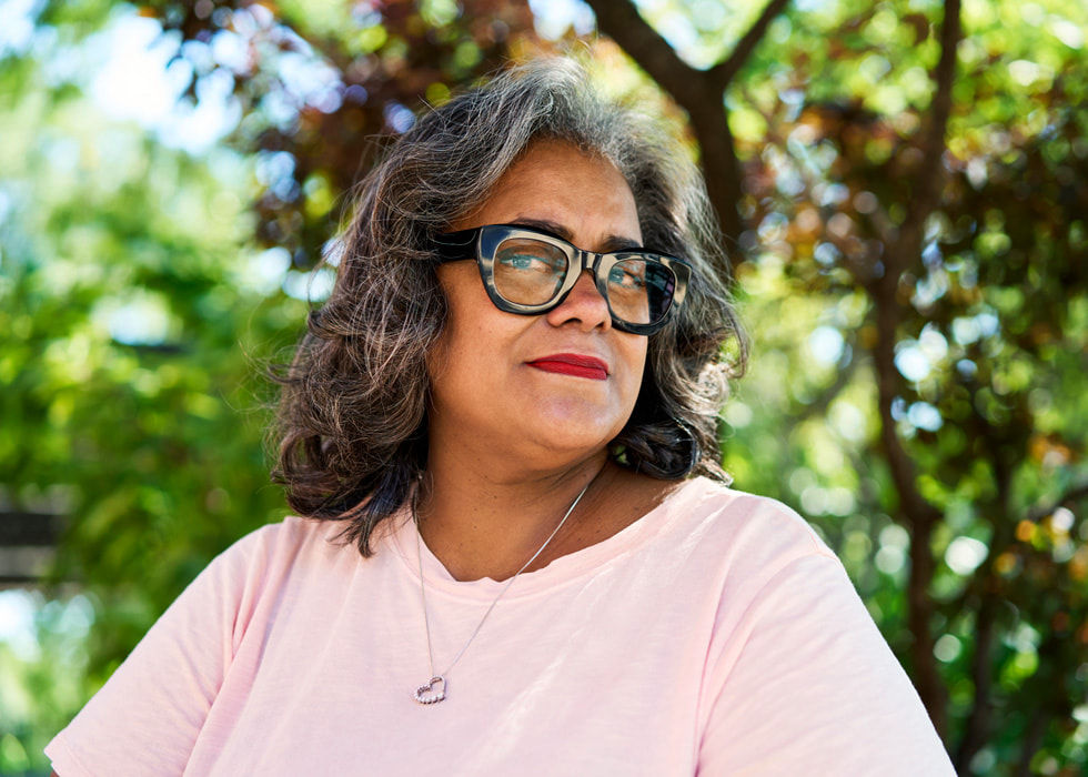 A close-up of Lisa Davis is shown outdoors.